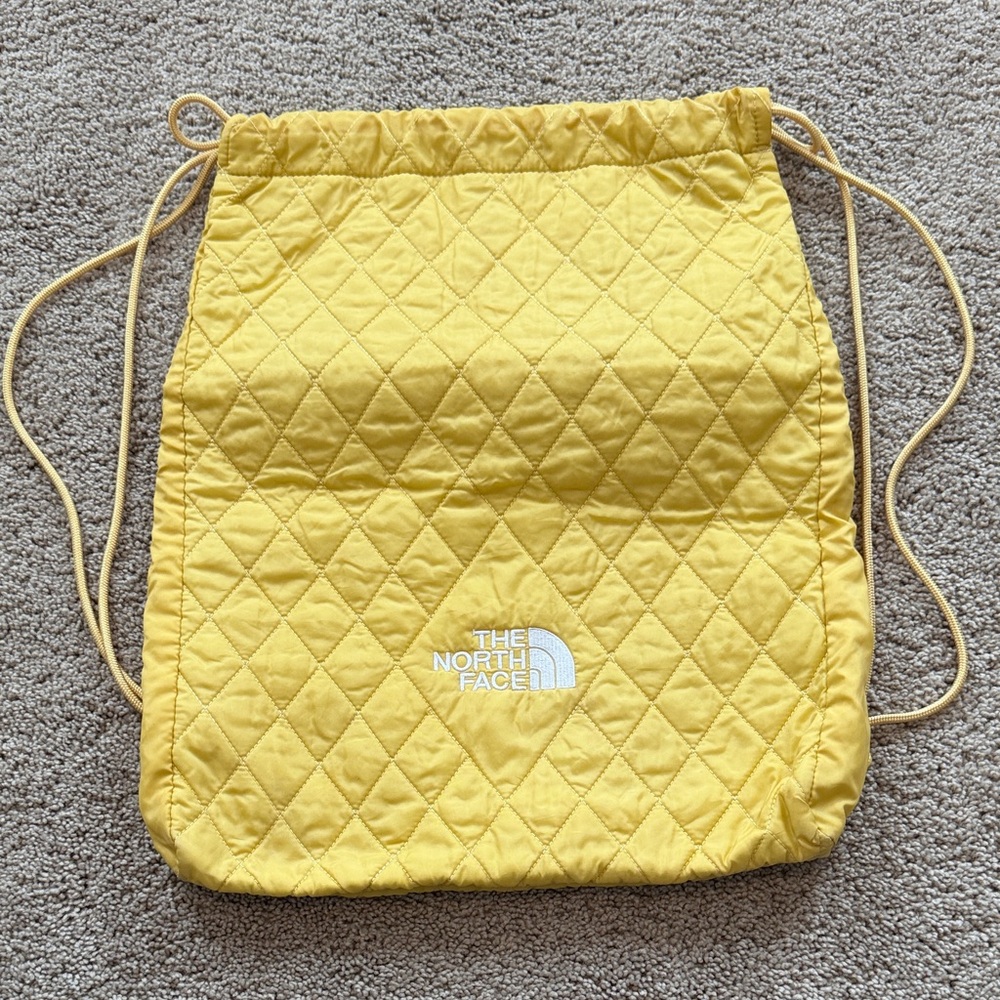 The North Face Yellow Quilted Drawstring Backpack